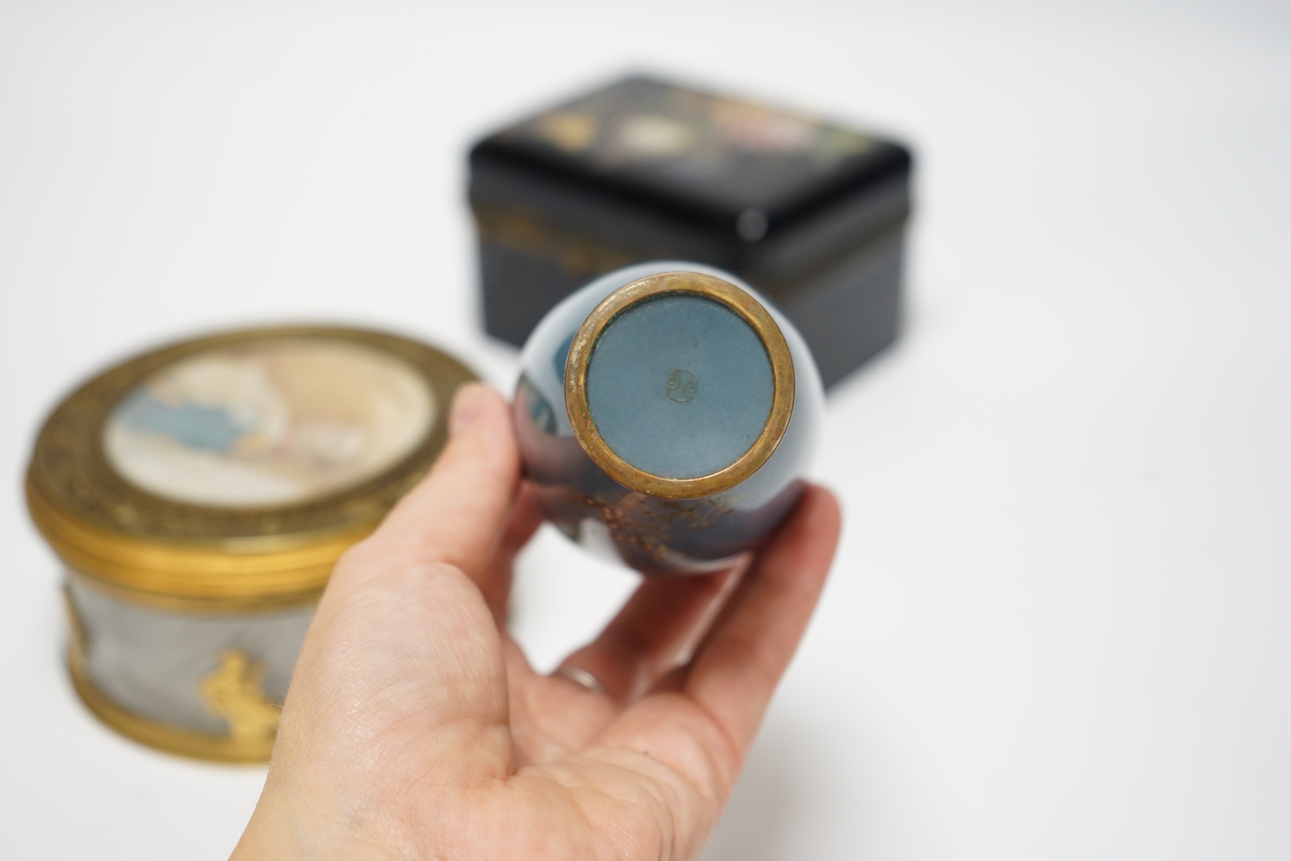 A Palais Royale circular gilt metal cut glass box with an inset portrait miniature of Napoleon on ivorine, 12cm diameter, a Bohemian enamelled glass box attributed to Moser, 12.5cm wide, a Japanese cloisonné enamel vase